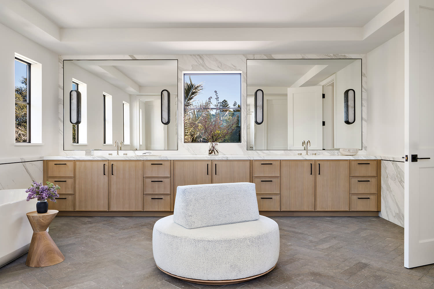 bright, contemporary bathroom with a double vanity