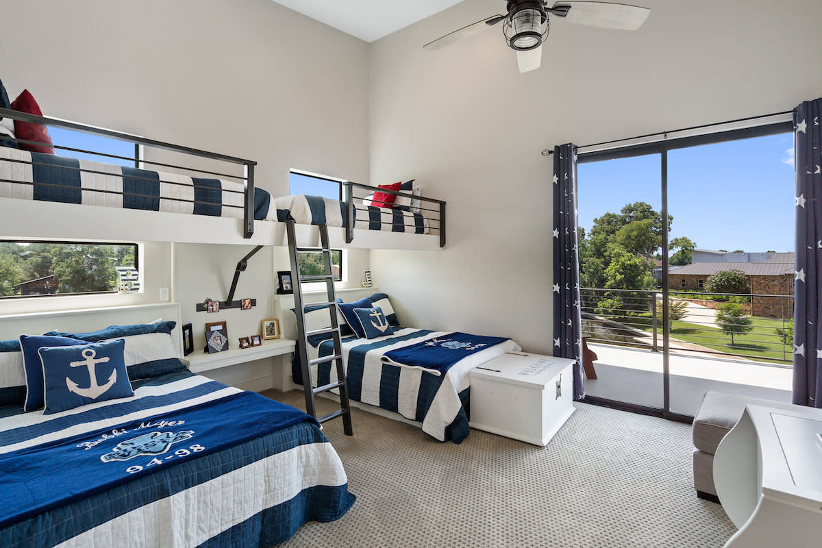 A cozy bedroom with bunk beds and a window, providing a comfortable and functional space for rest and relaxation.