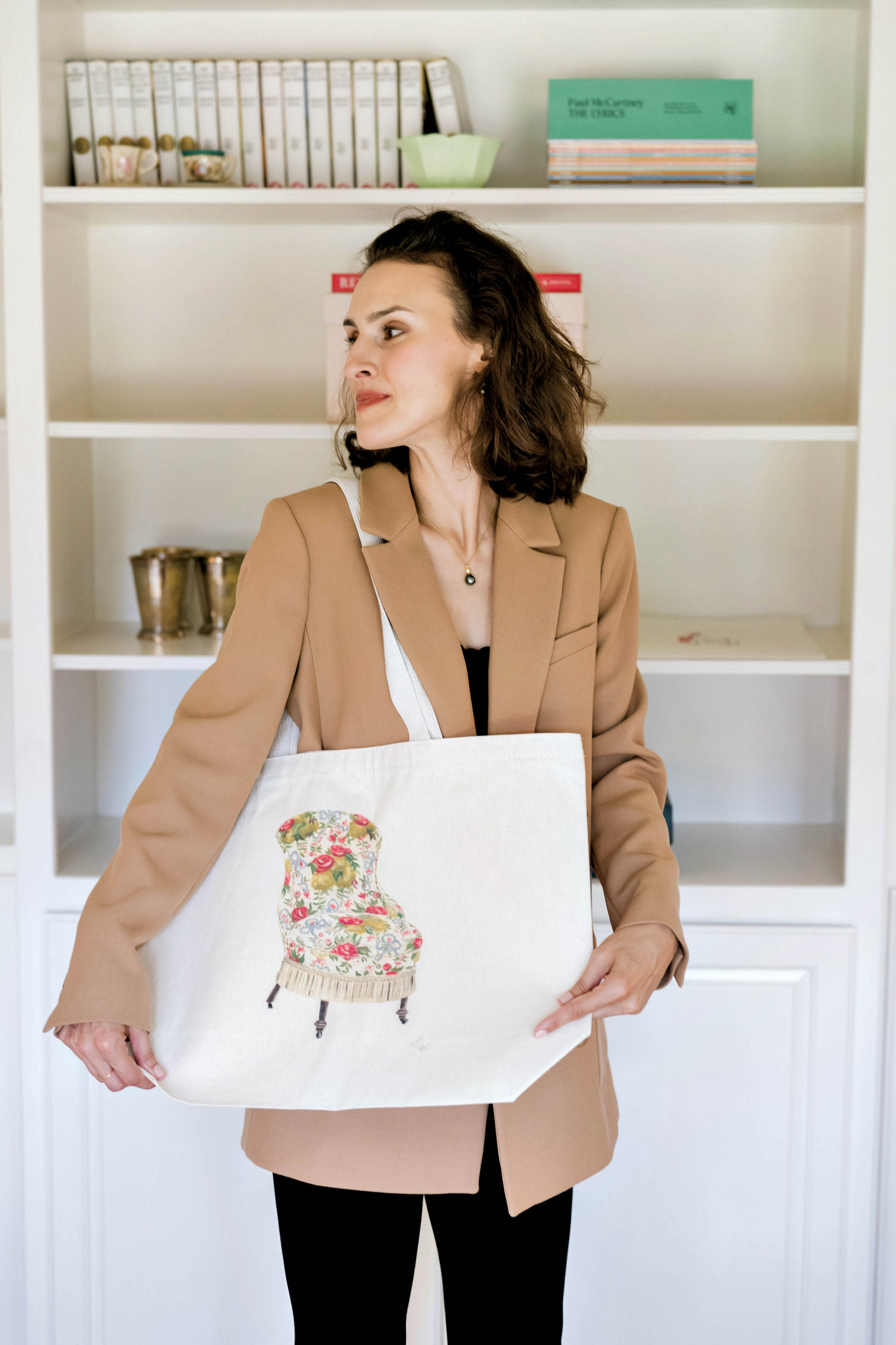 Paulette Pearson holding a tote from her collaboration with Hunt & Bloom