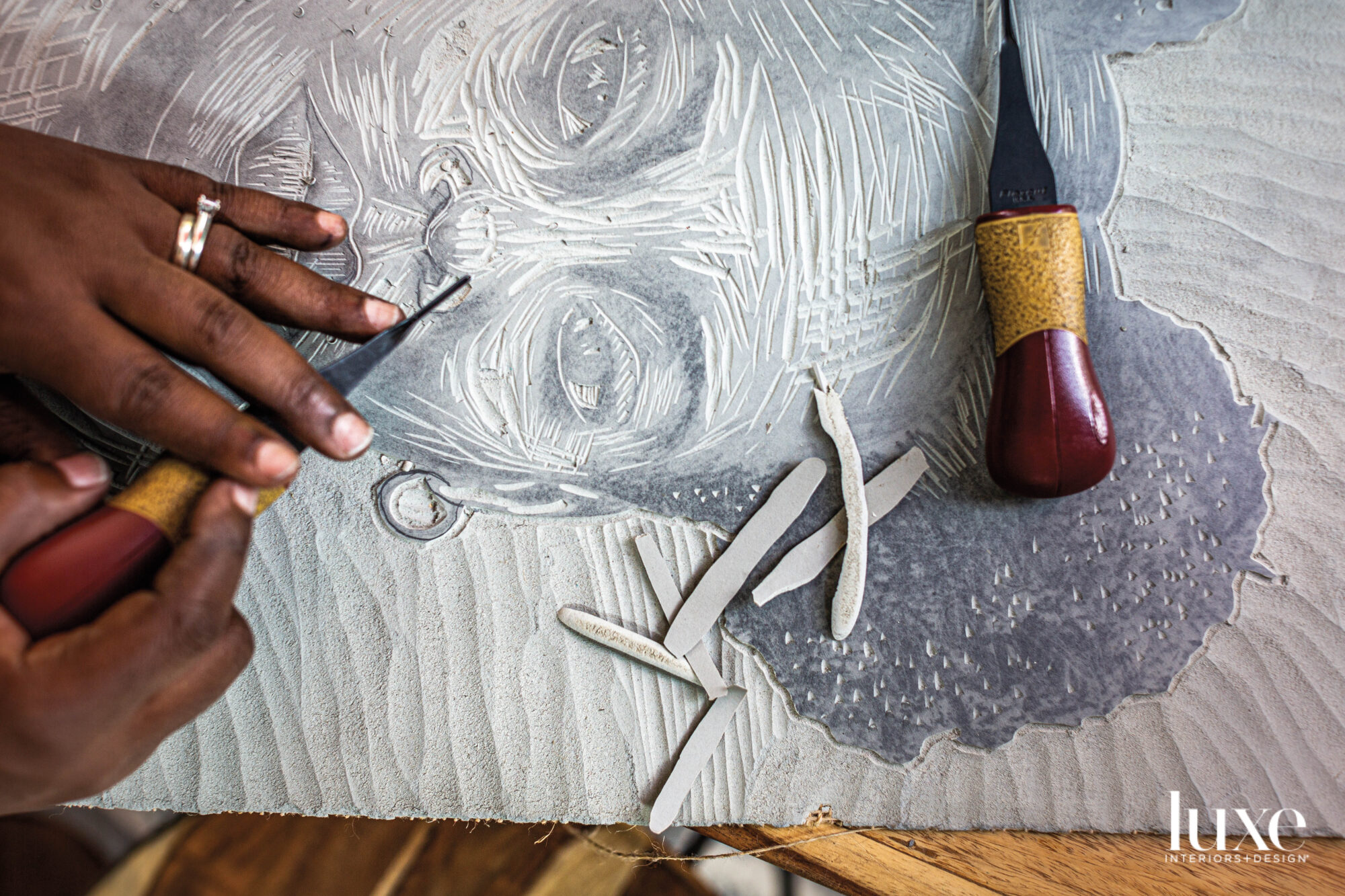 Wood carving step in the relief printing process.