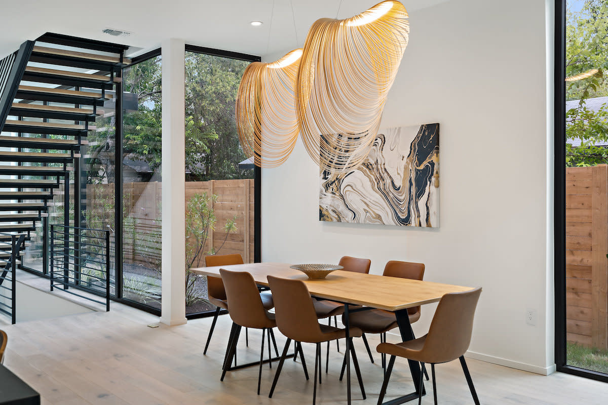 A well-furnished dining room with a wooden table and comfortable chairs for a cozy meal setting.