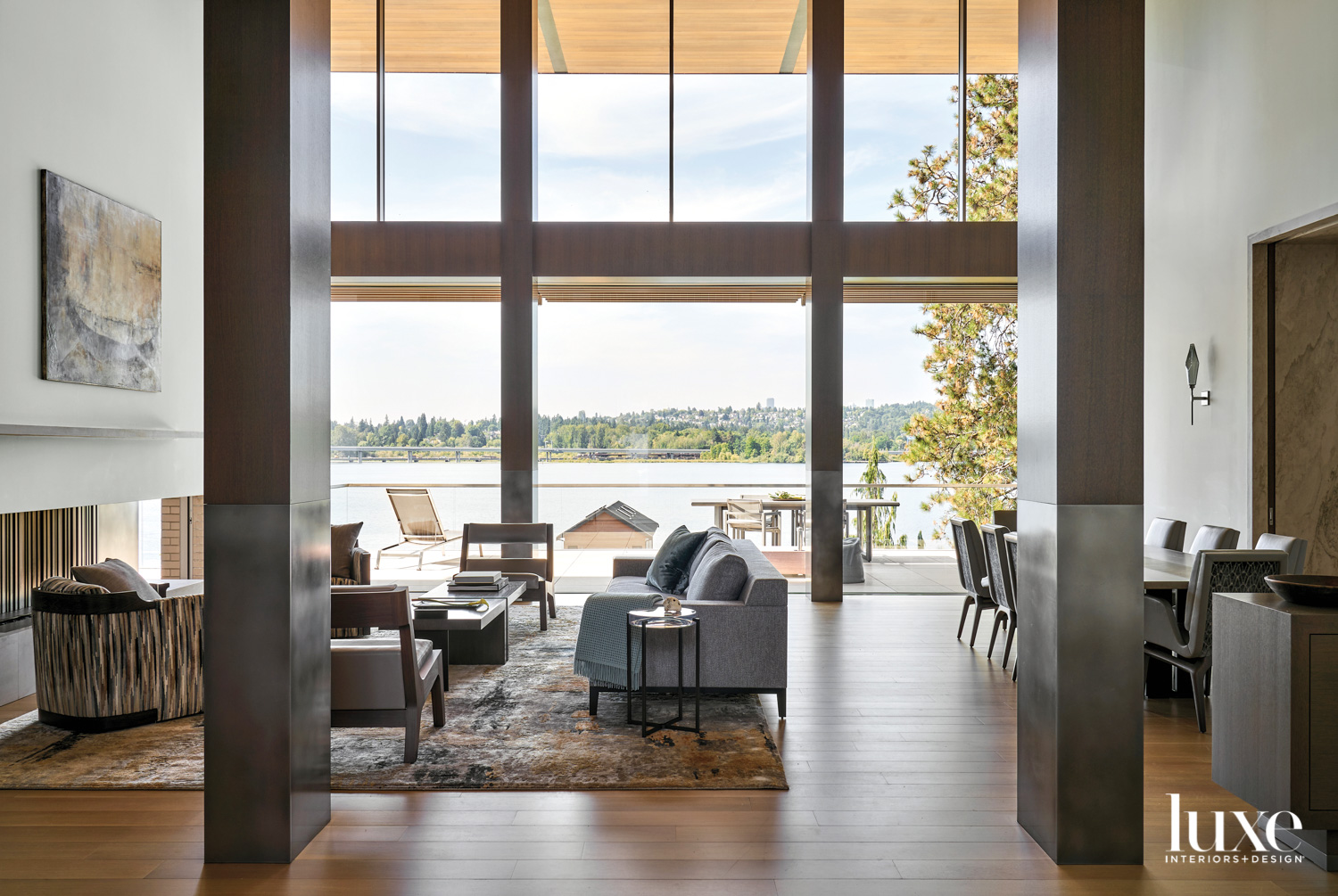 Shot of living and dining areas with water in background