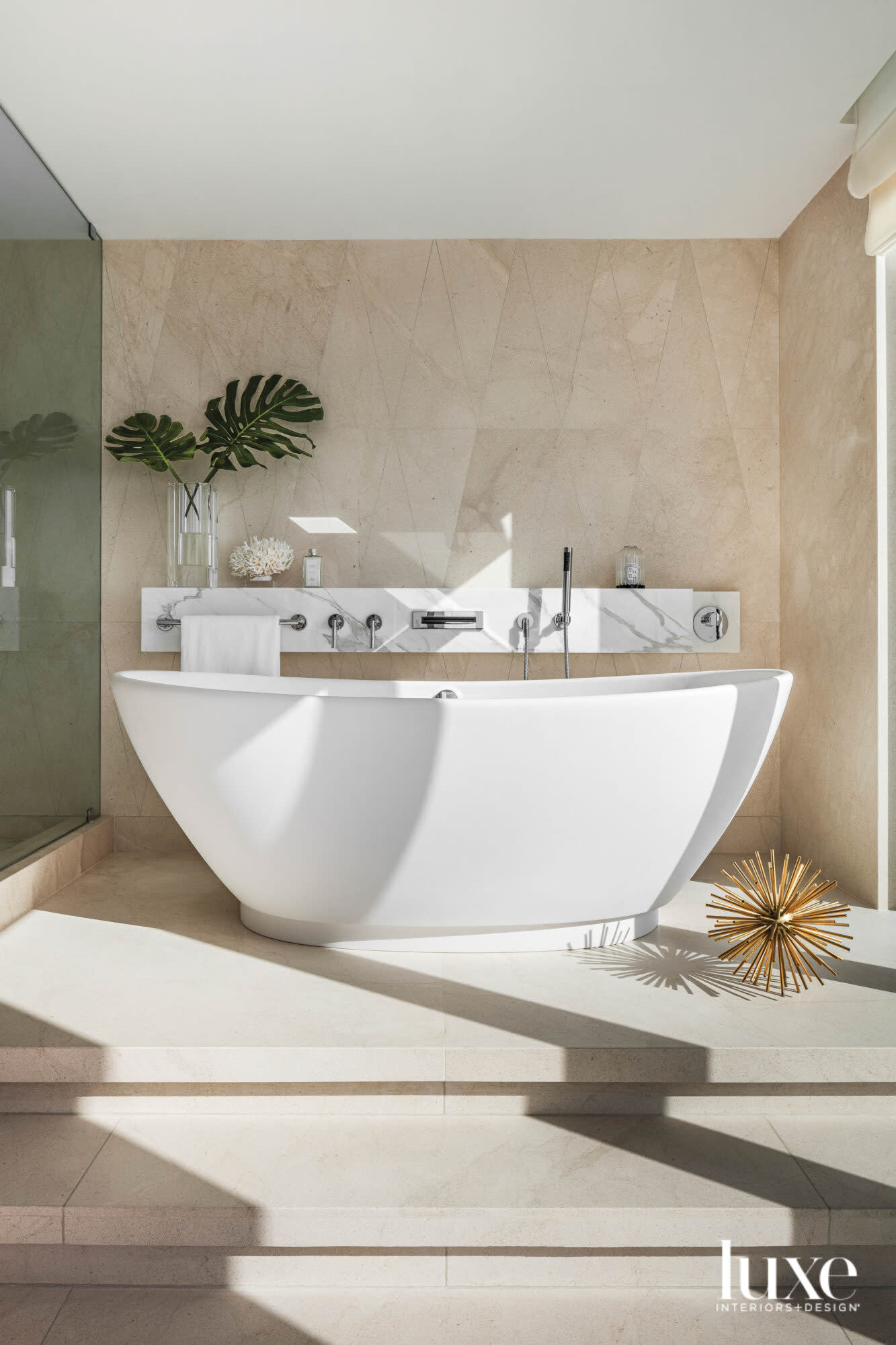 bathroom with freestanding white tub