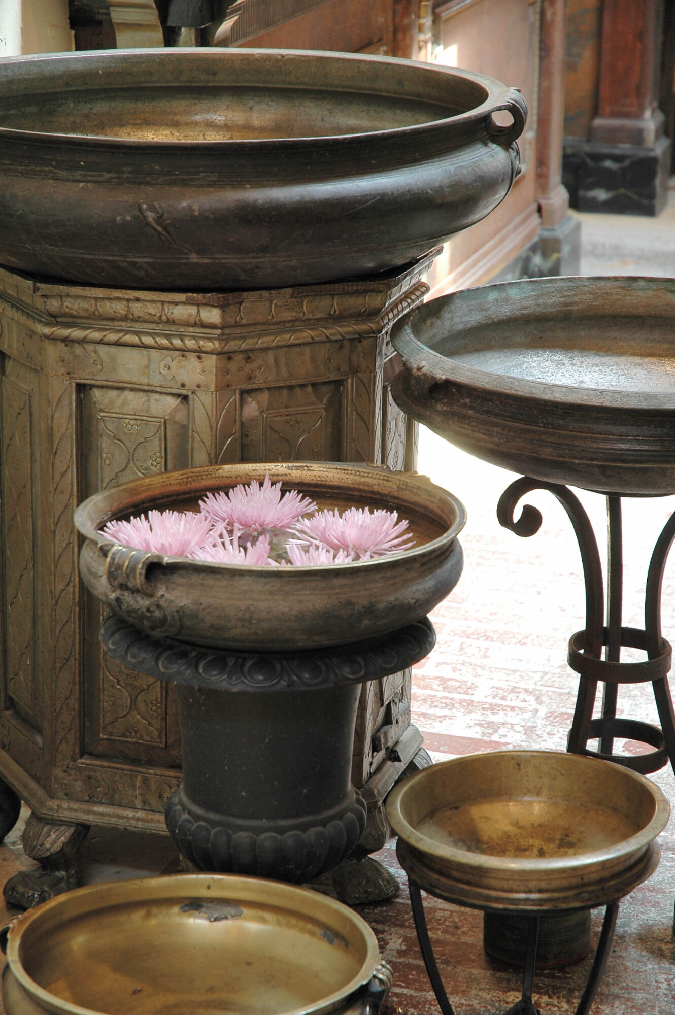 antique bowl holding floating flowers