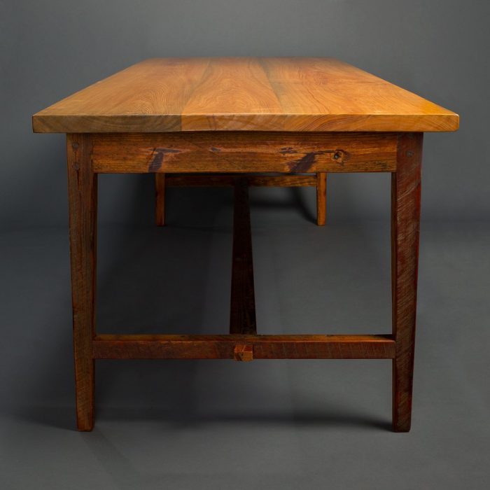 A side view of his Stretcher Base Signature Farm Table