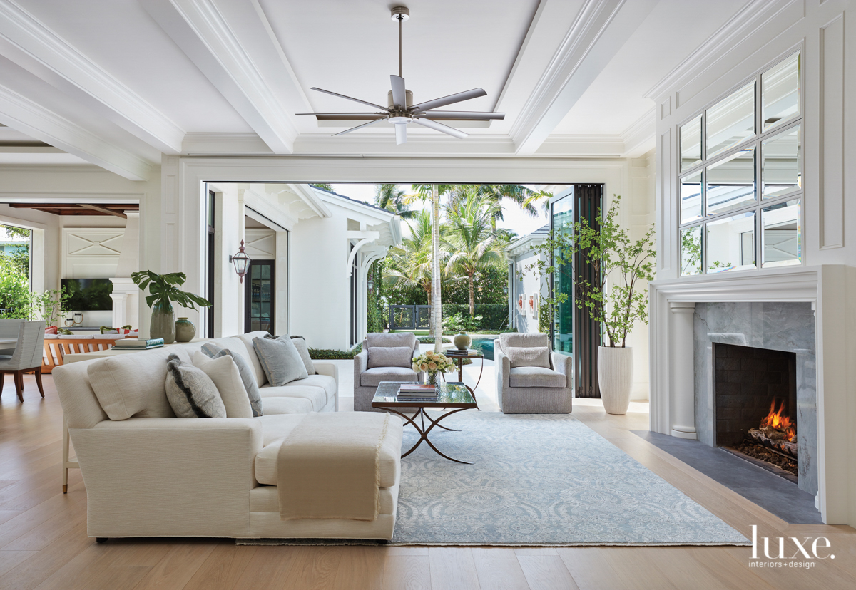 living room with Lee Jofa sofa and armchairs and wool rug