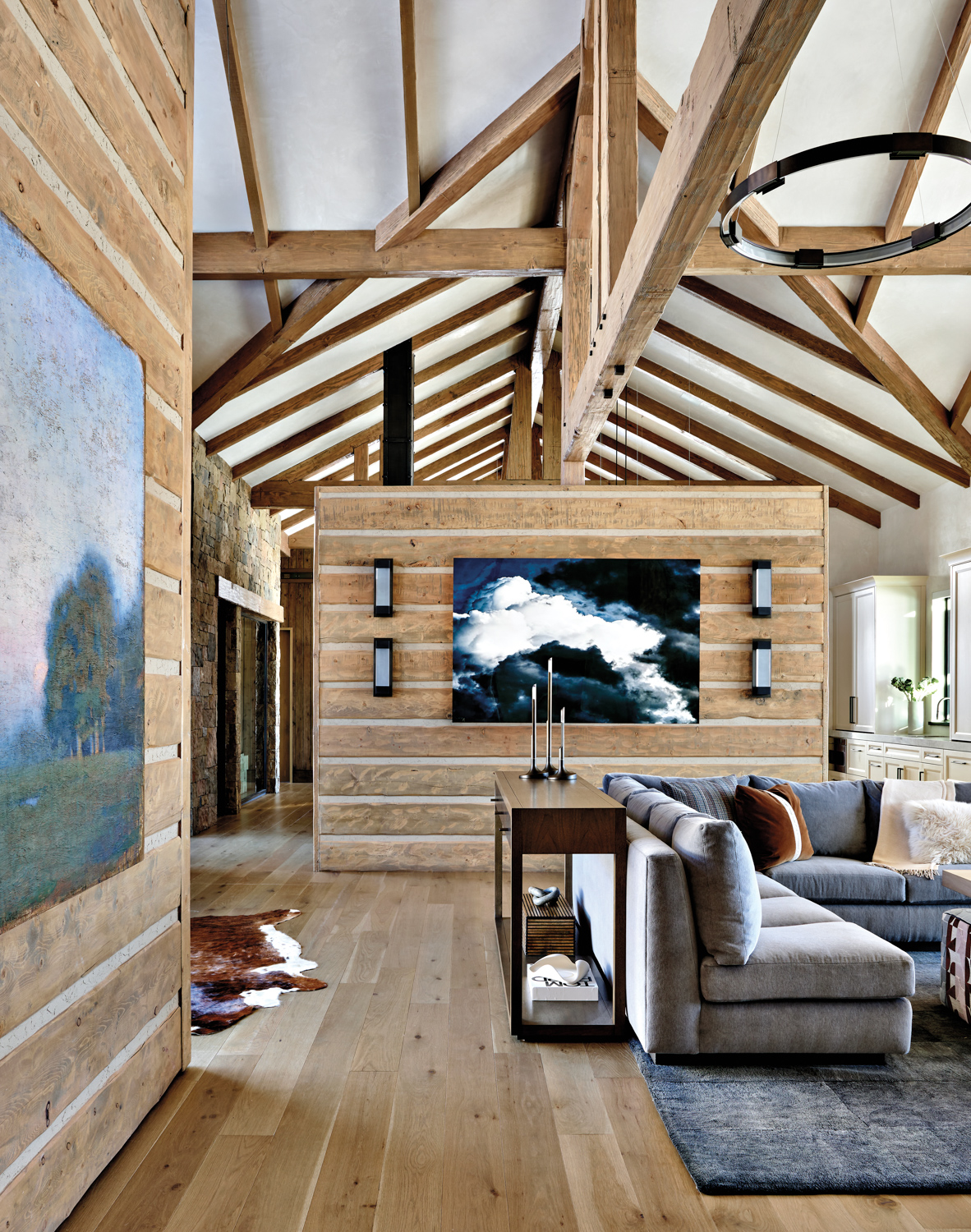 ranch-style great room with high arched ceilings and exposed wooden beams