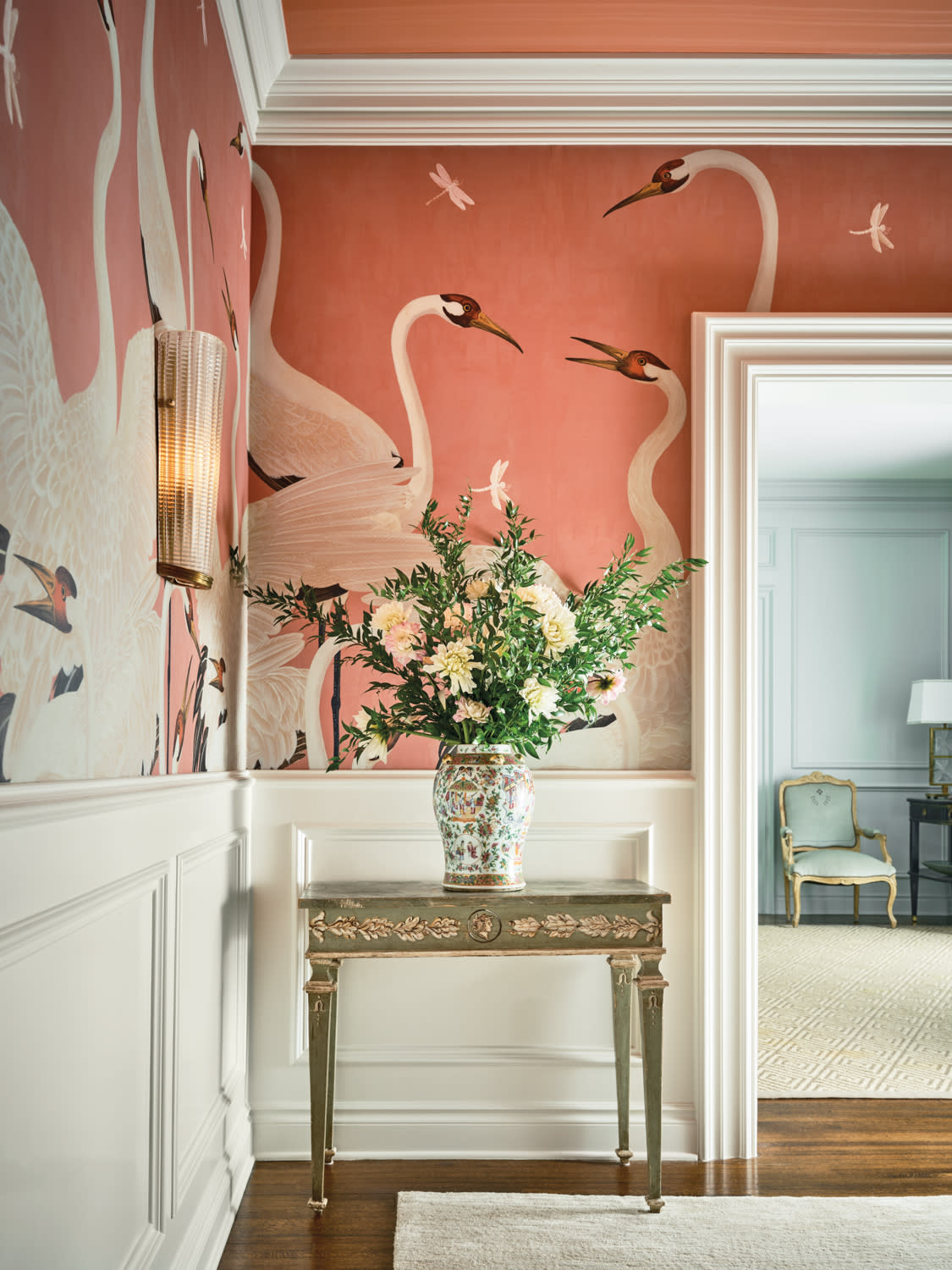 Gucci's Heron wallpaper wraps the dining room of a traditional Texas home