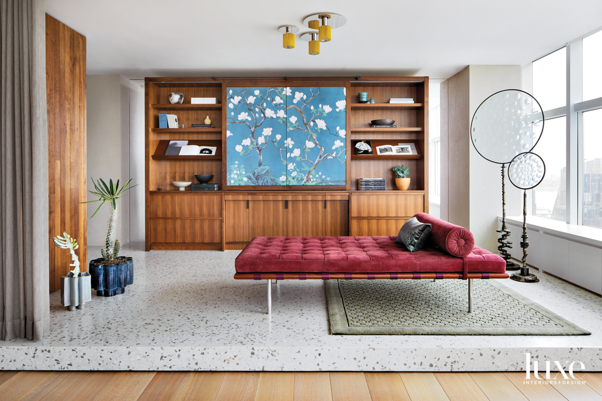 terrazzo plinth with wallnut millwork and pink lounge