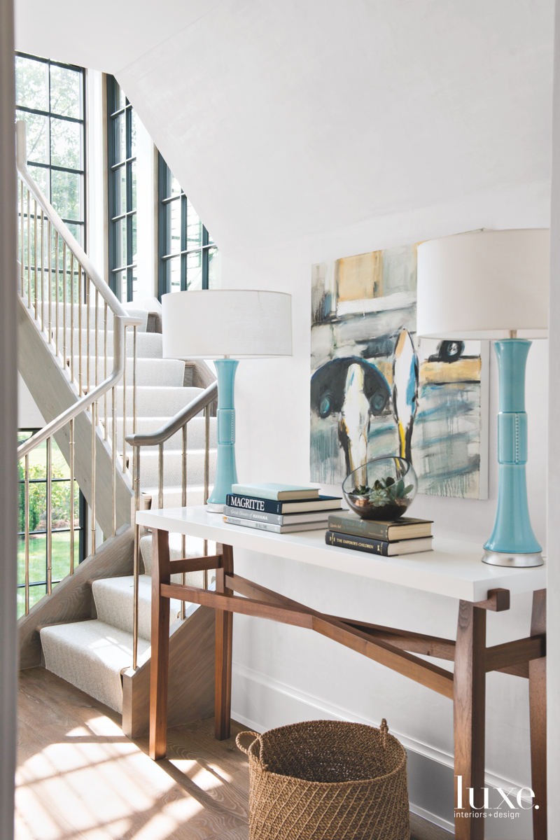 transitional white stairs blue lamps