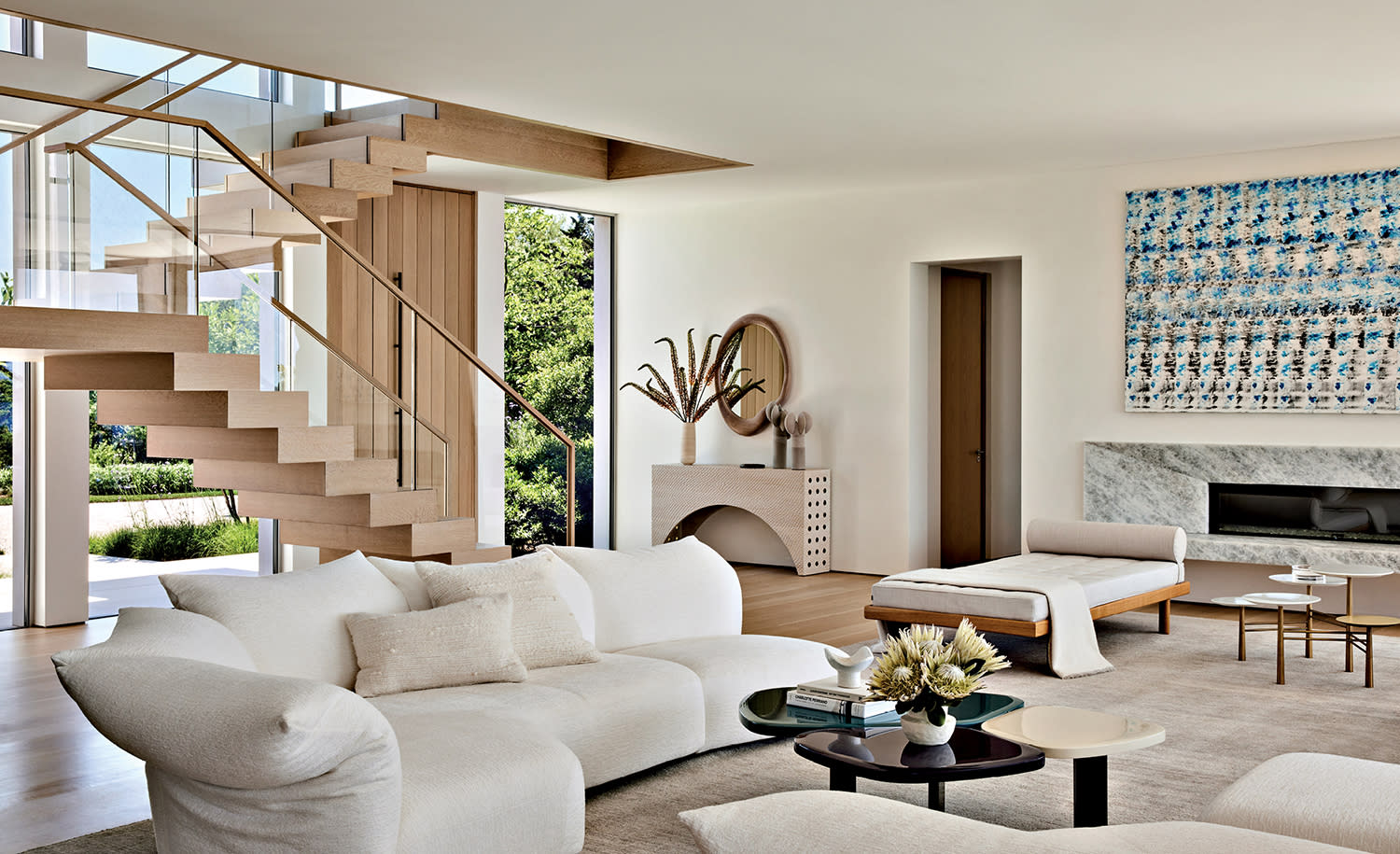 contemporary living room with a white sofa and a sleek fireplace