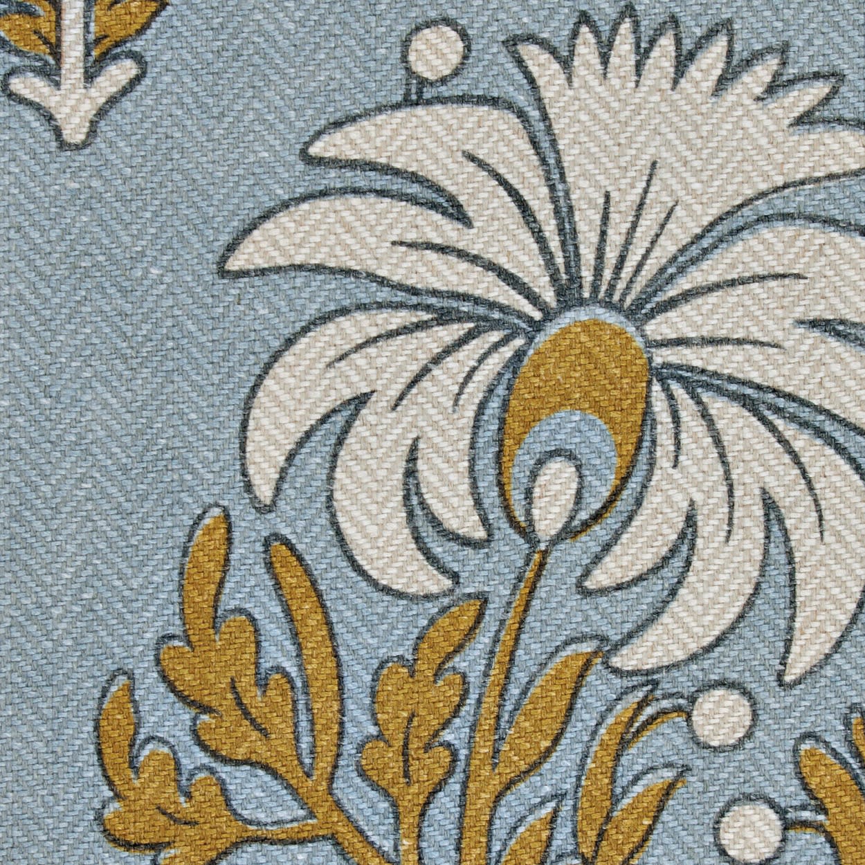 flower motif fabric with a blue background and white and yellow flower