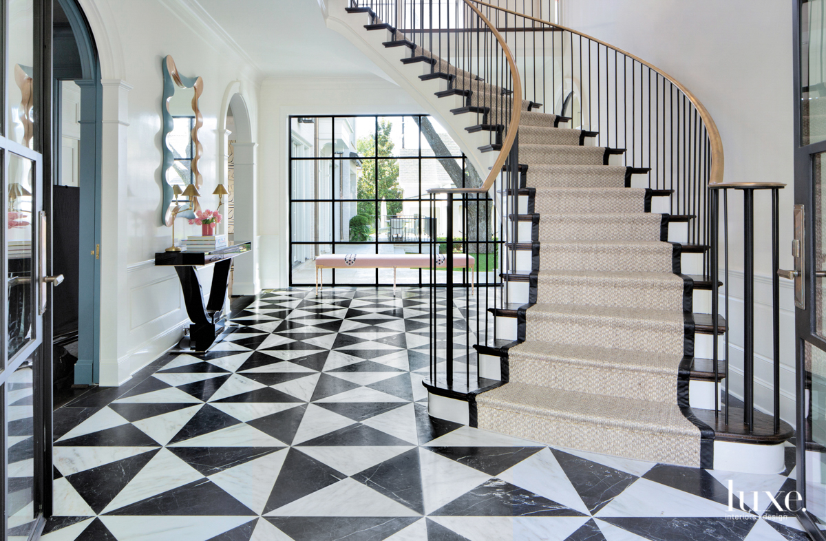 Entryway with black and white marble flooring