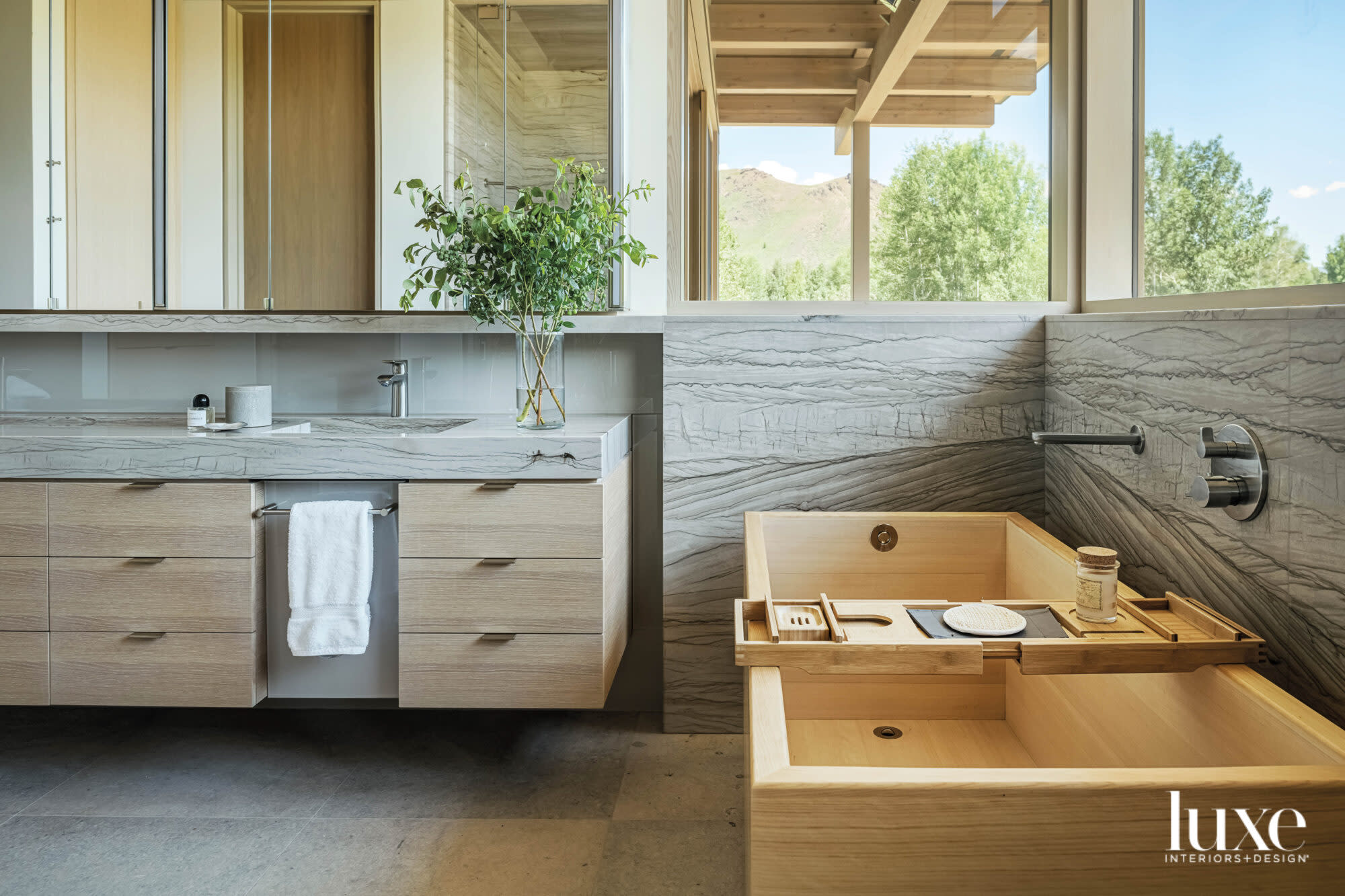 Shot of main bathroom with vanity and soaking tub