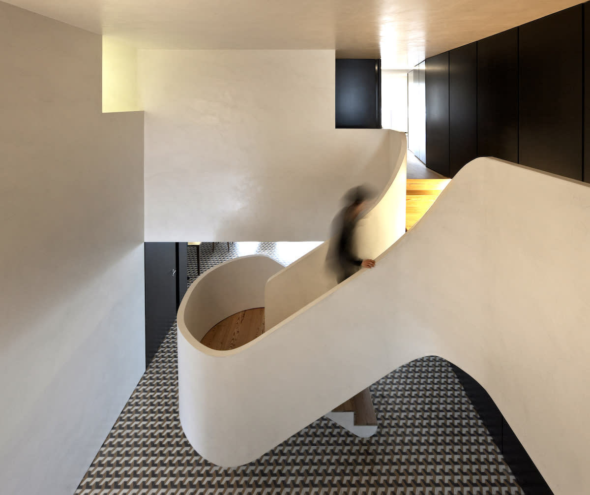 Large white staircase, geometric flooring