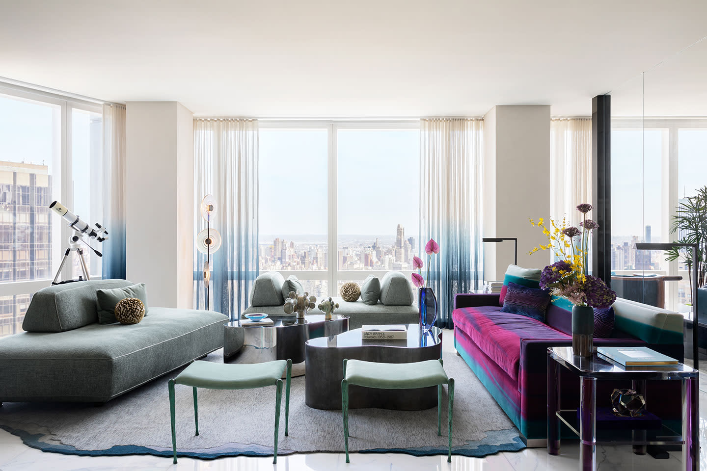 purple and pink couch in light filled living room by peti lau