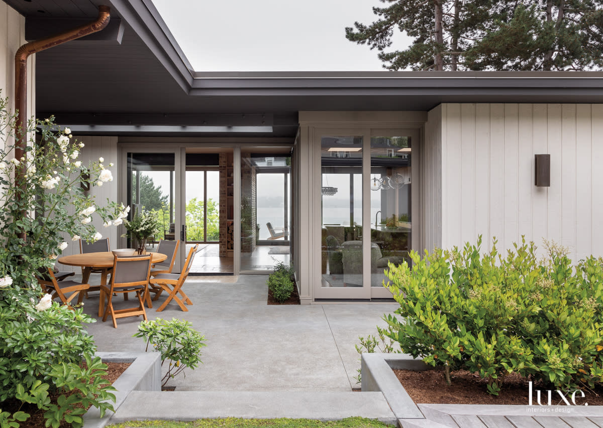backyard with sitting area and windows to the inside