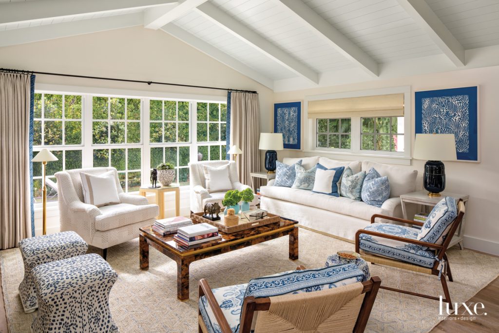 living room with sofa covered in linen armchairs and coffee table