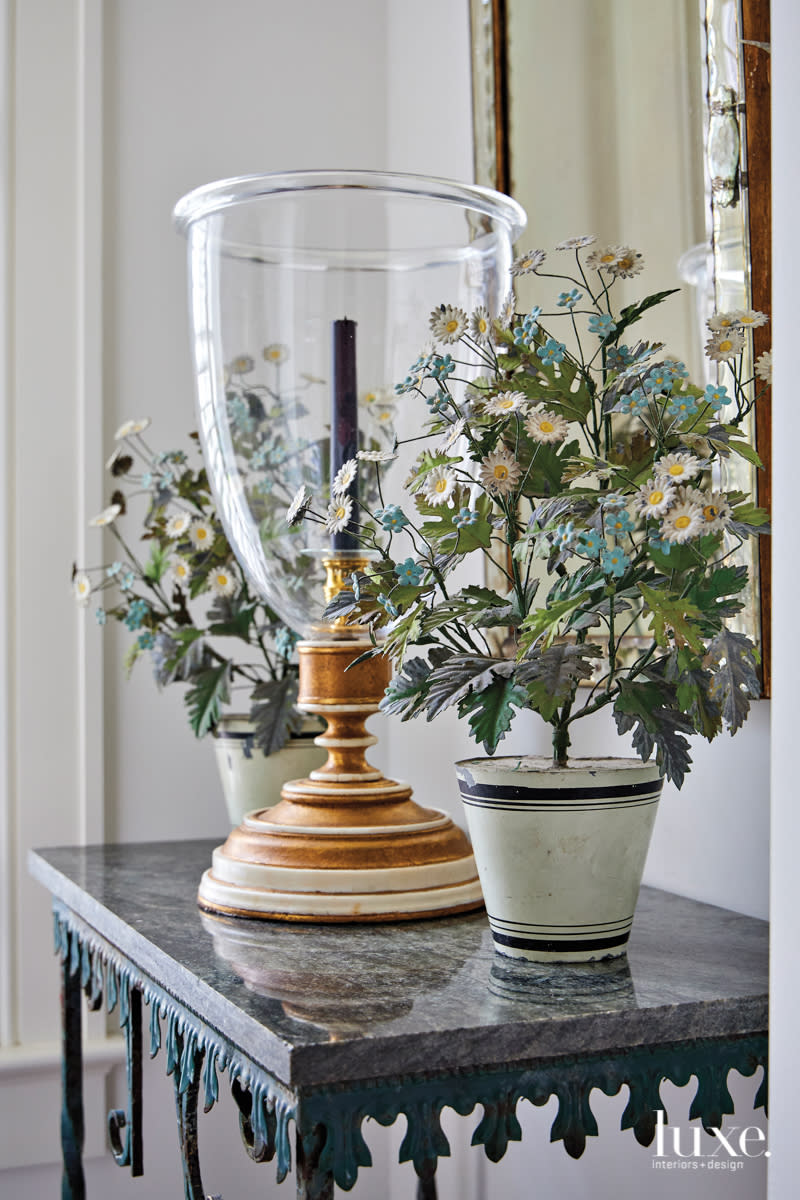 lamp on blue antique metal table with marble top