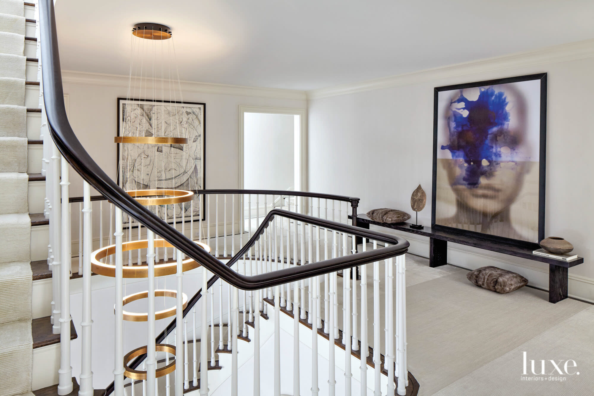 stairwell landing with halim al karim artwork