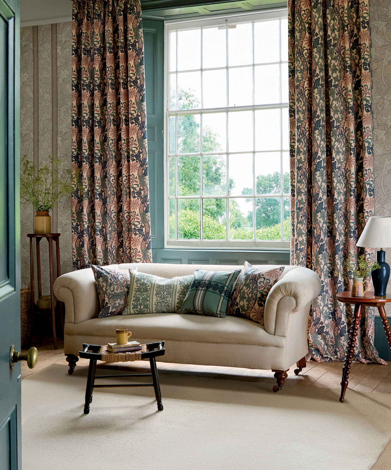 living room vignette showcasing one of The Unfinished Works by Morris & Co. on the drapery and wallpaper