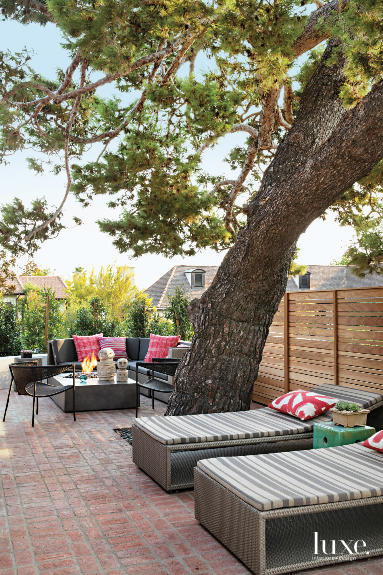 Garden view with tree, loungers and seating area