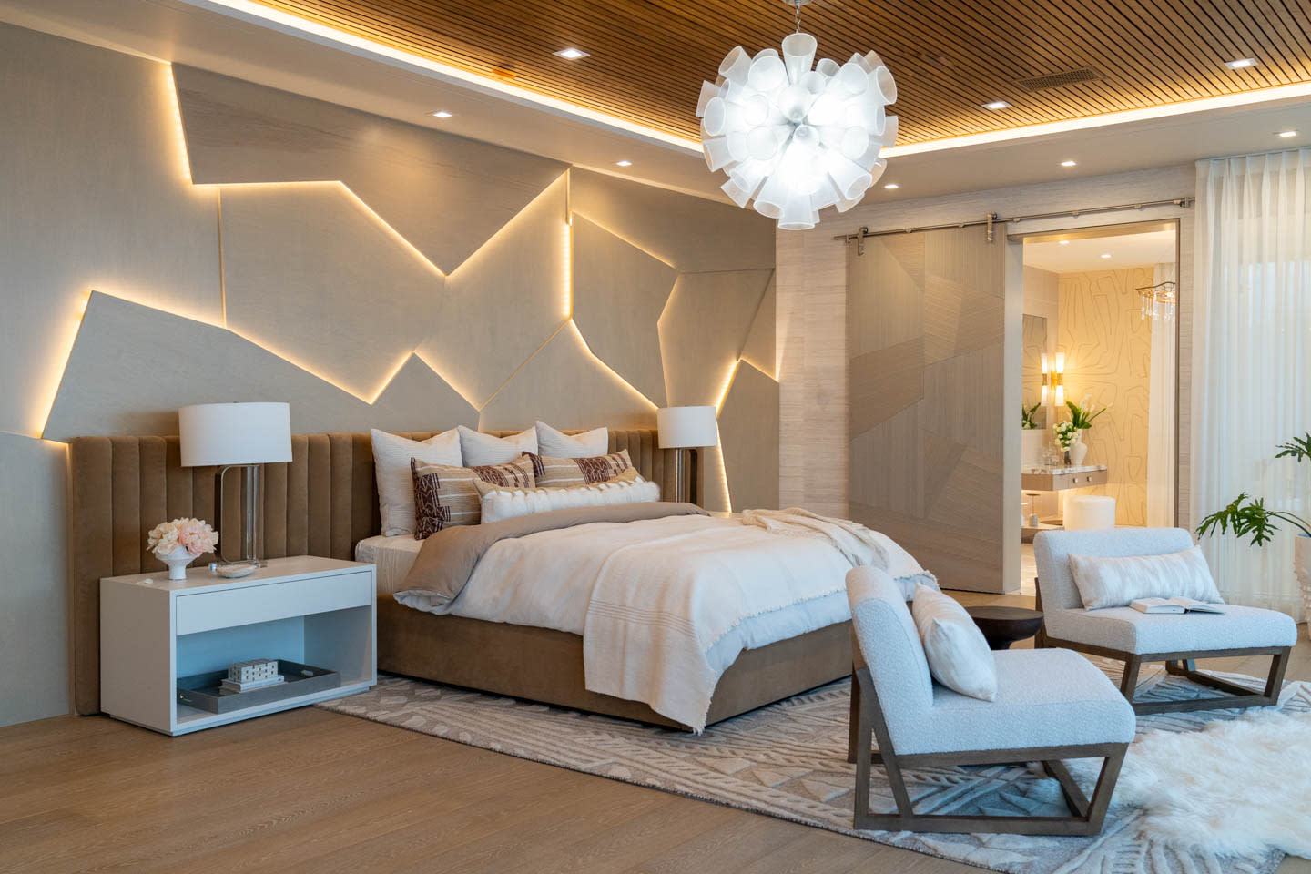 contemporary bedroom with unique lighting strips along the headboard wall