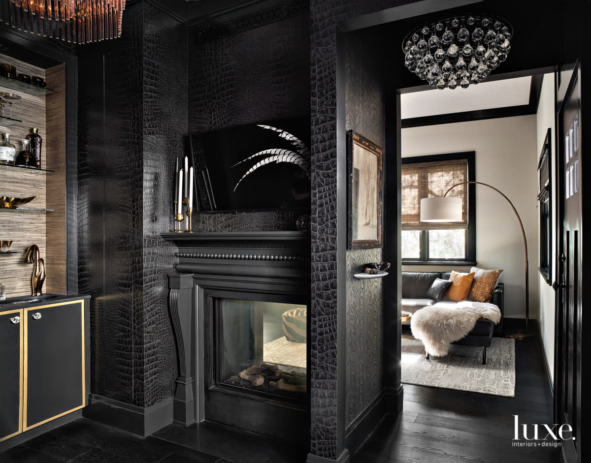 black carved fireplace surround with west elm black sectional