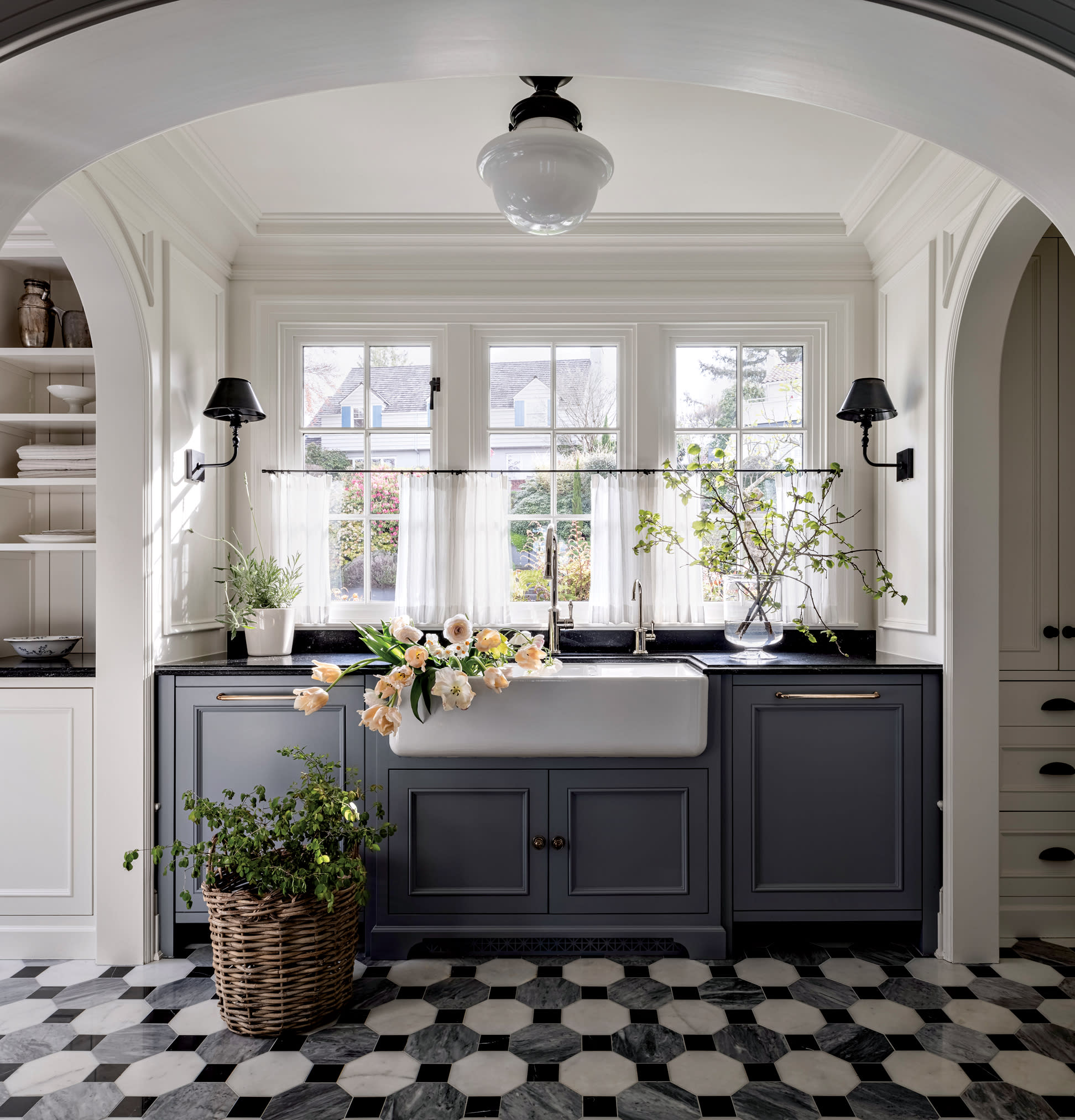 white kitchen with blue cabinetry