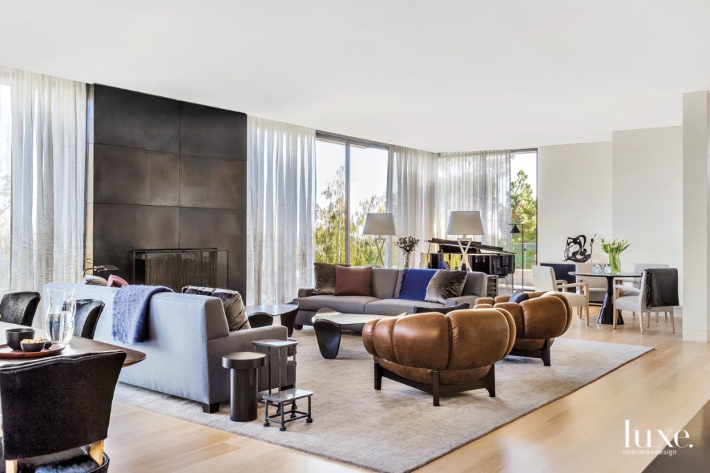 Family and friend gatherings are on the agenda in this living room. Guests take seats for impromptu piano recitals on Heather Hilliard-designed sofas and Jean de Merry armchairs, while kids do homework on the Sancal game table. The pair of Fado coffee tables are by Emmanuel Levet Stenne and Isabelle Sicart.