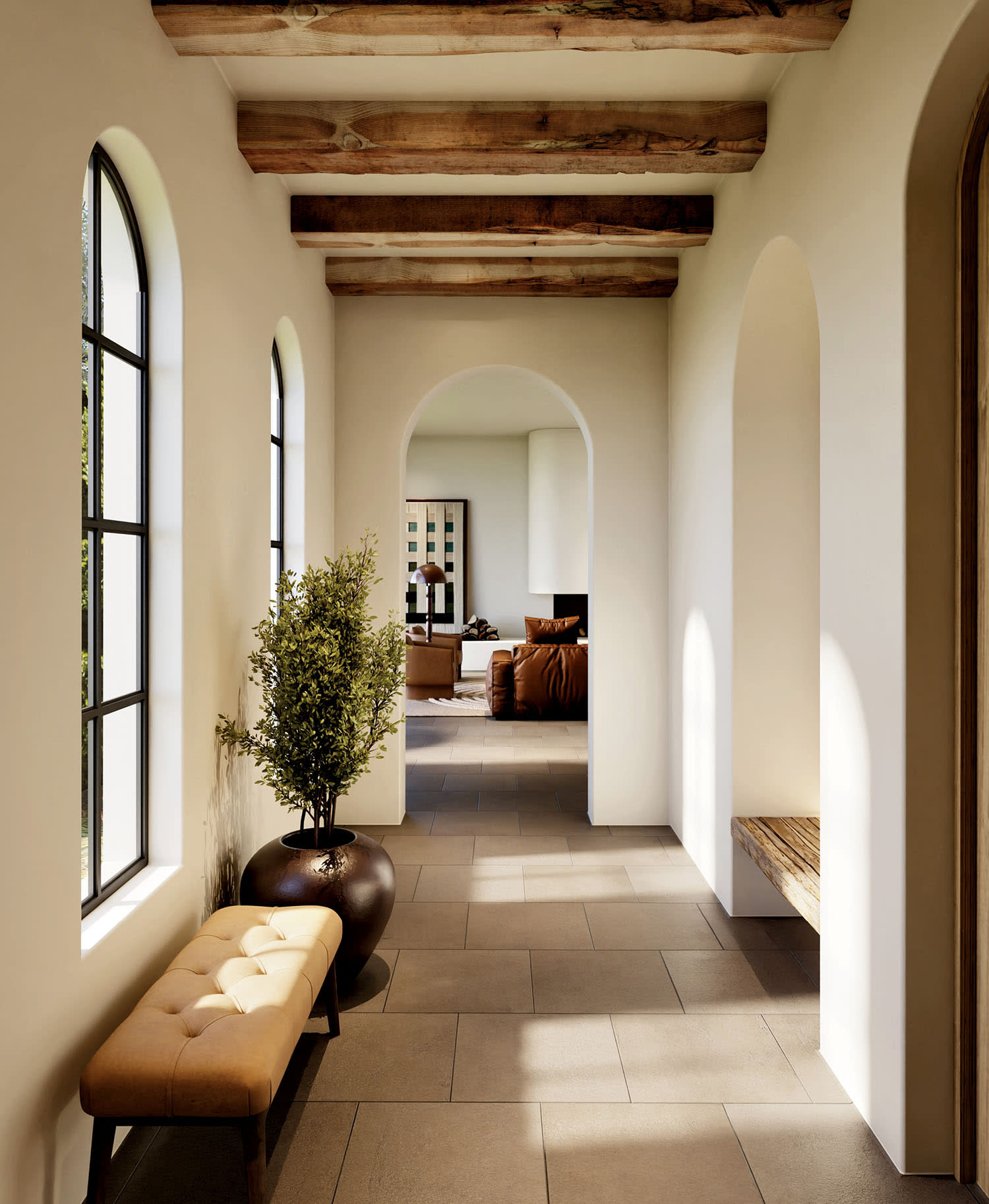 A hallway with white walls, bright windows and a bench and nearby plant flanking the hall.