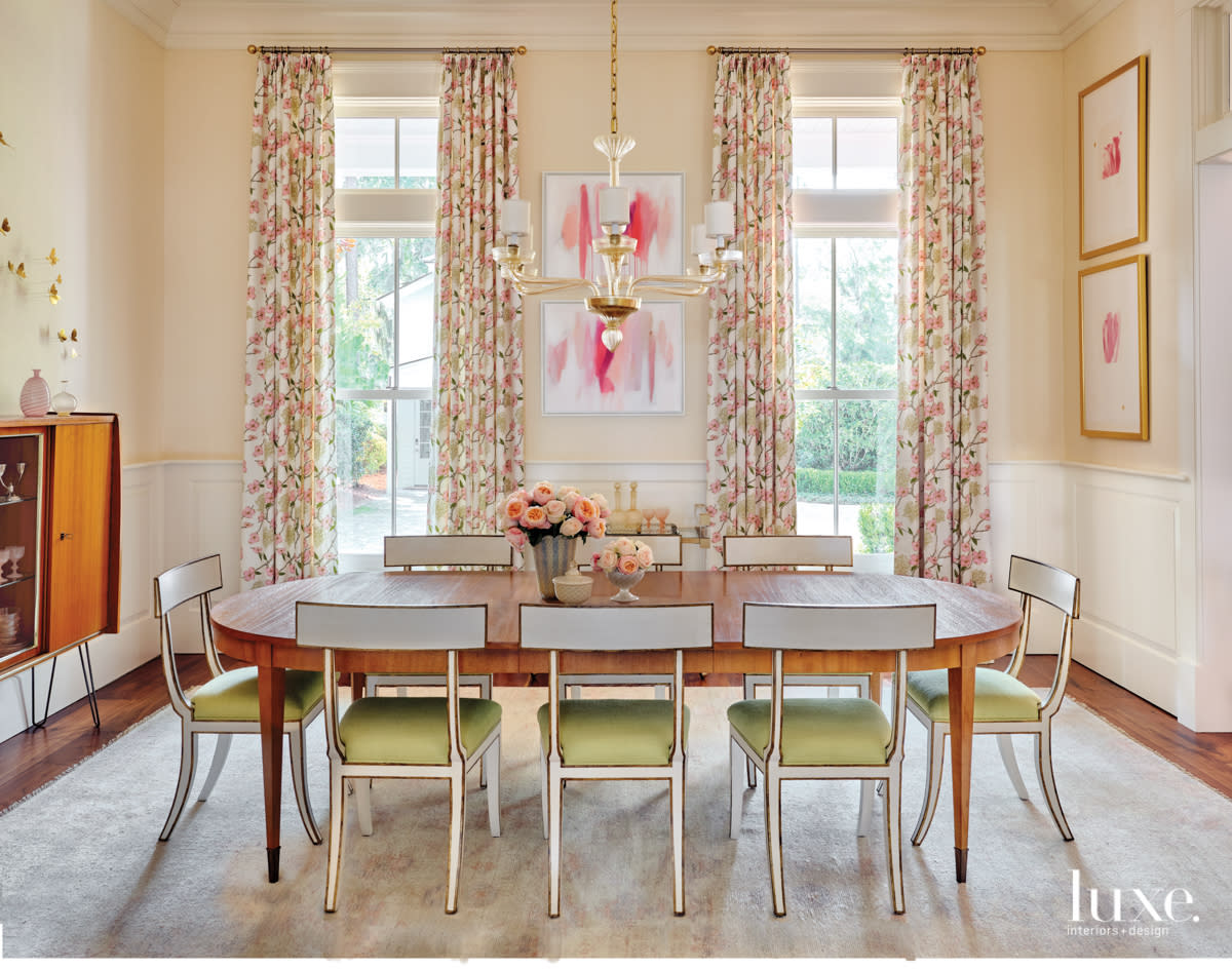 dogwood-print drapes in dining room with pink and green accents