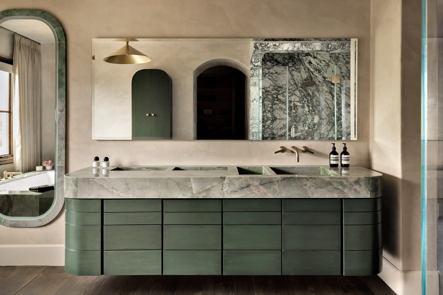 modern bathroom with green custom vanity