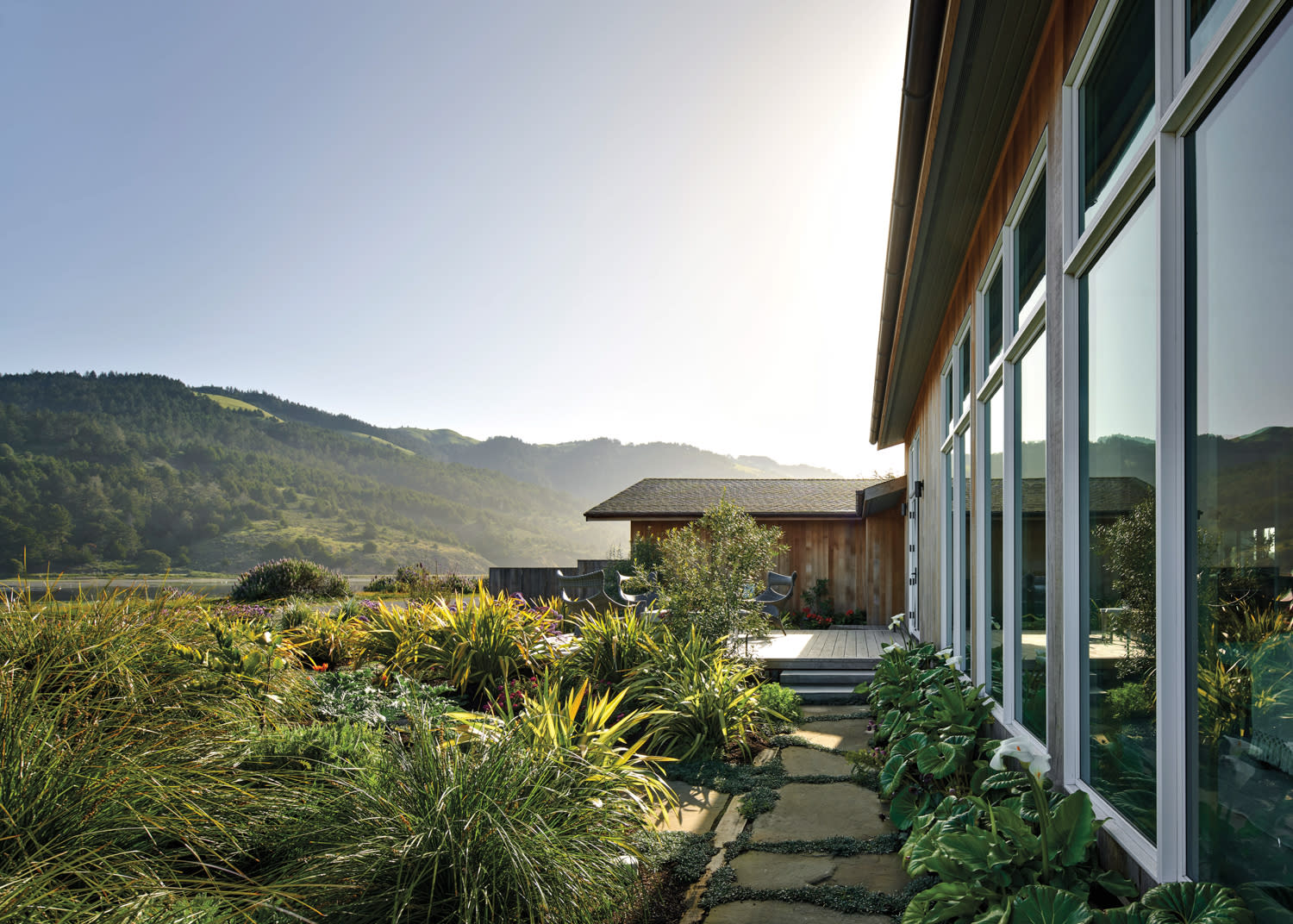 Large windows look out over Bolinas Lagoon in home by Lindsay Brier