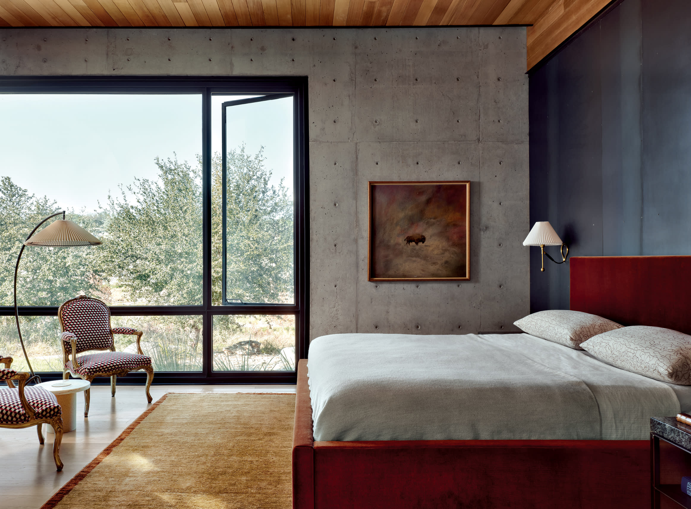 industrial bedroom with a mix of vintage and modernist furnishings