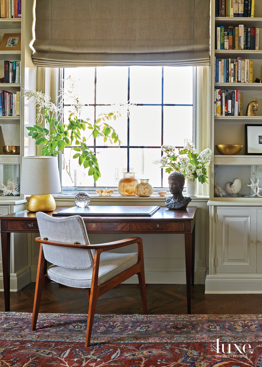 vintage mahogany writing table in colorful office