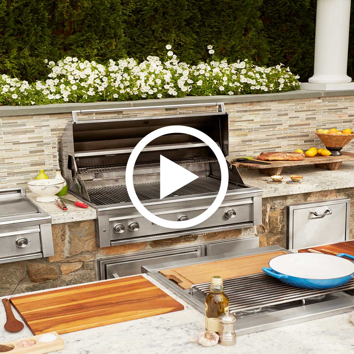 custom outdoor kitchen ajmadison appliances and food spread