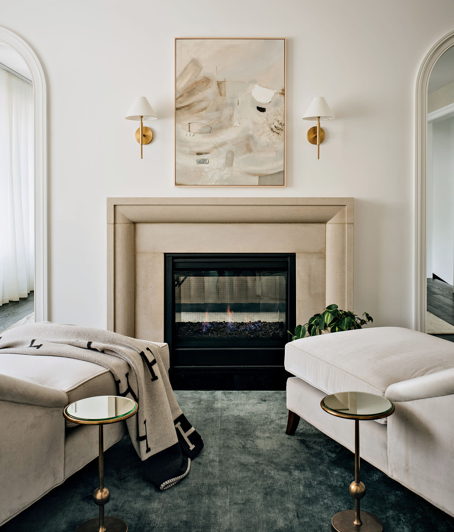 contemporary seating area inside the primary bedroom of a home designed by Amy Storm