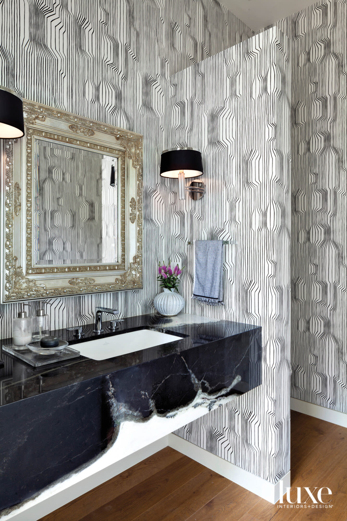 powder room with geometric black-and-white wallpaper