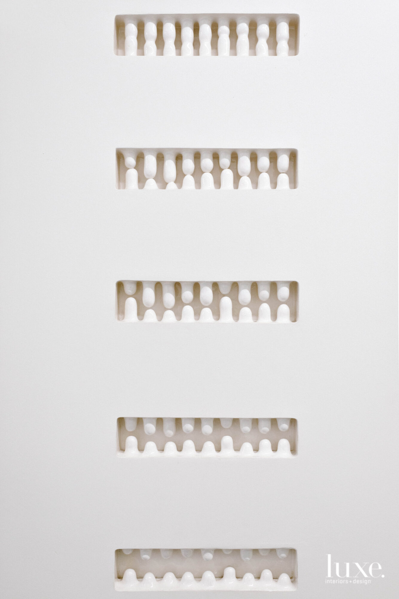 Ceramic pieces inset into a wall