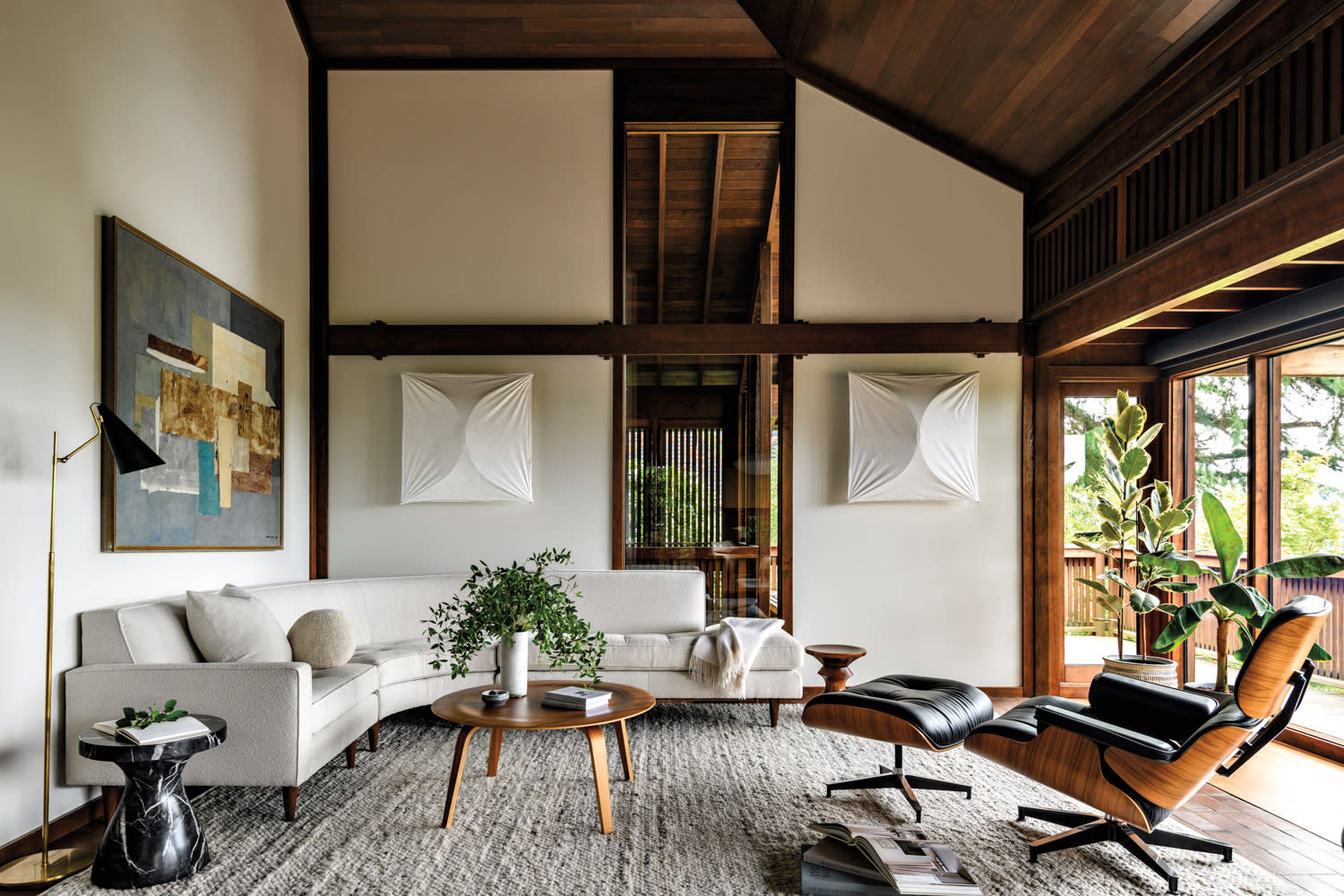 living room with high ceilings and wooden beams