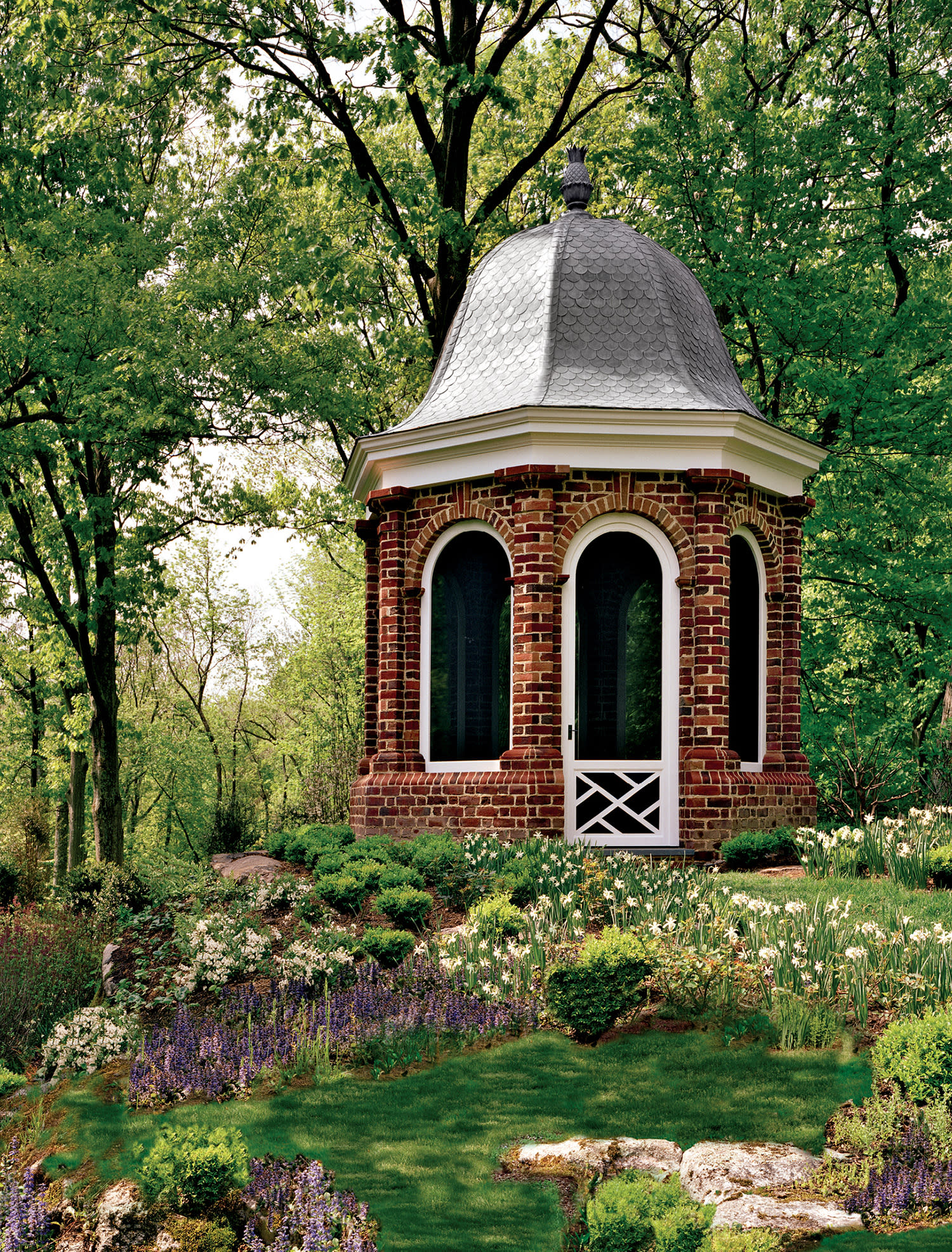 brick gazebo in a woodland setting