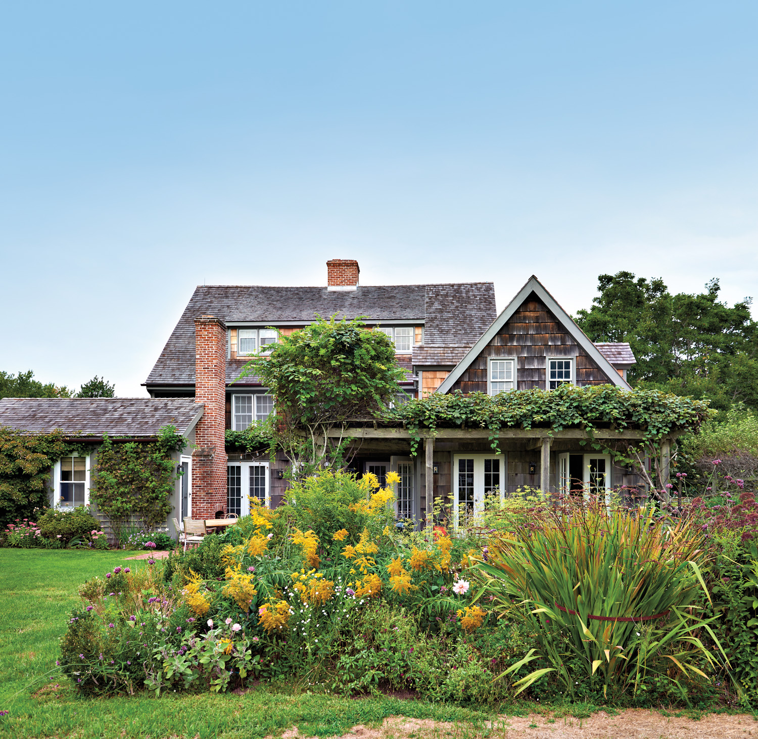 exterior of a Hamptons home with lush landscaping