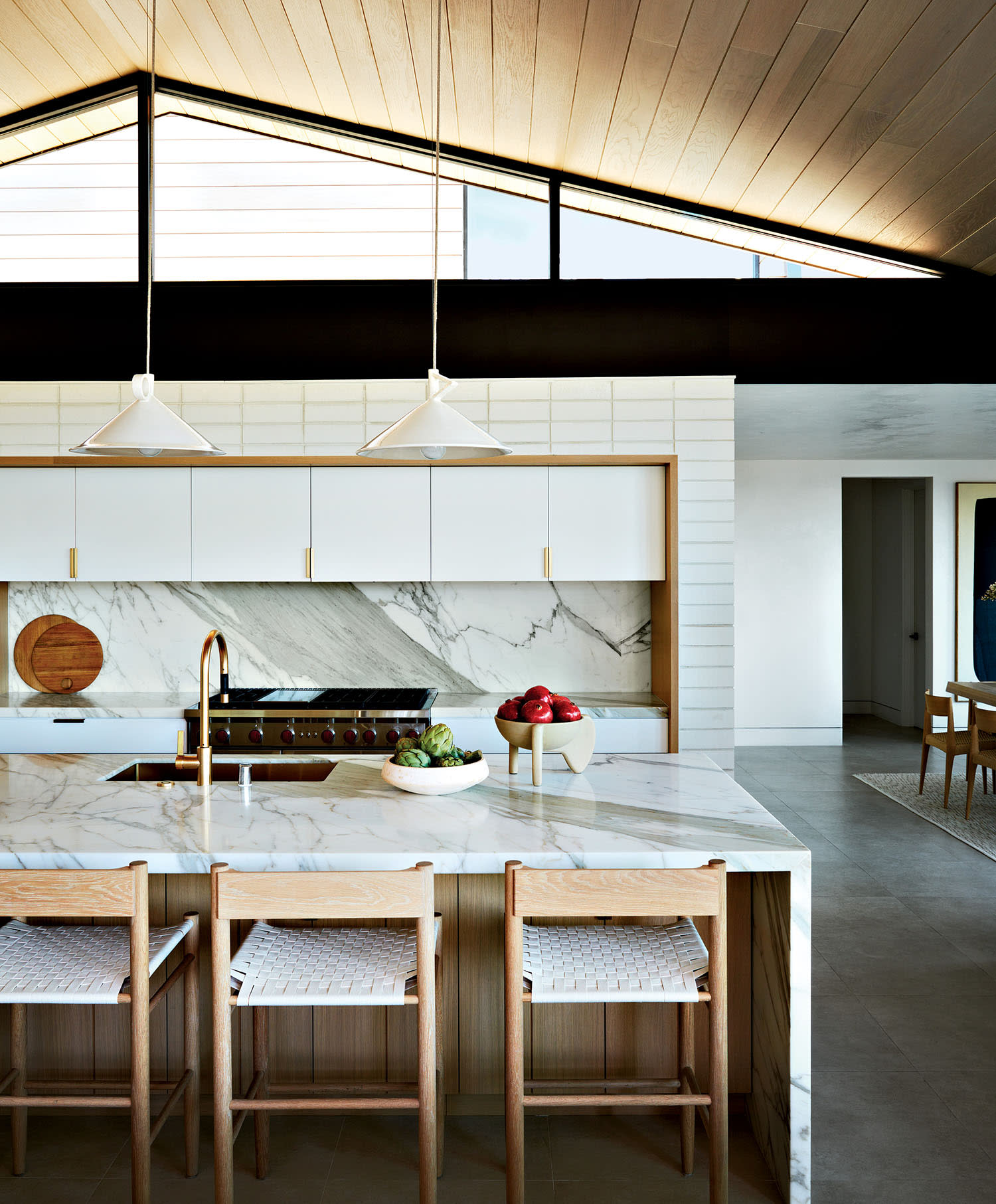 kitchen featuring Calacatta Borghini marble on the counters and range splash