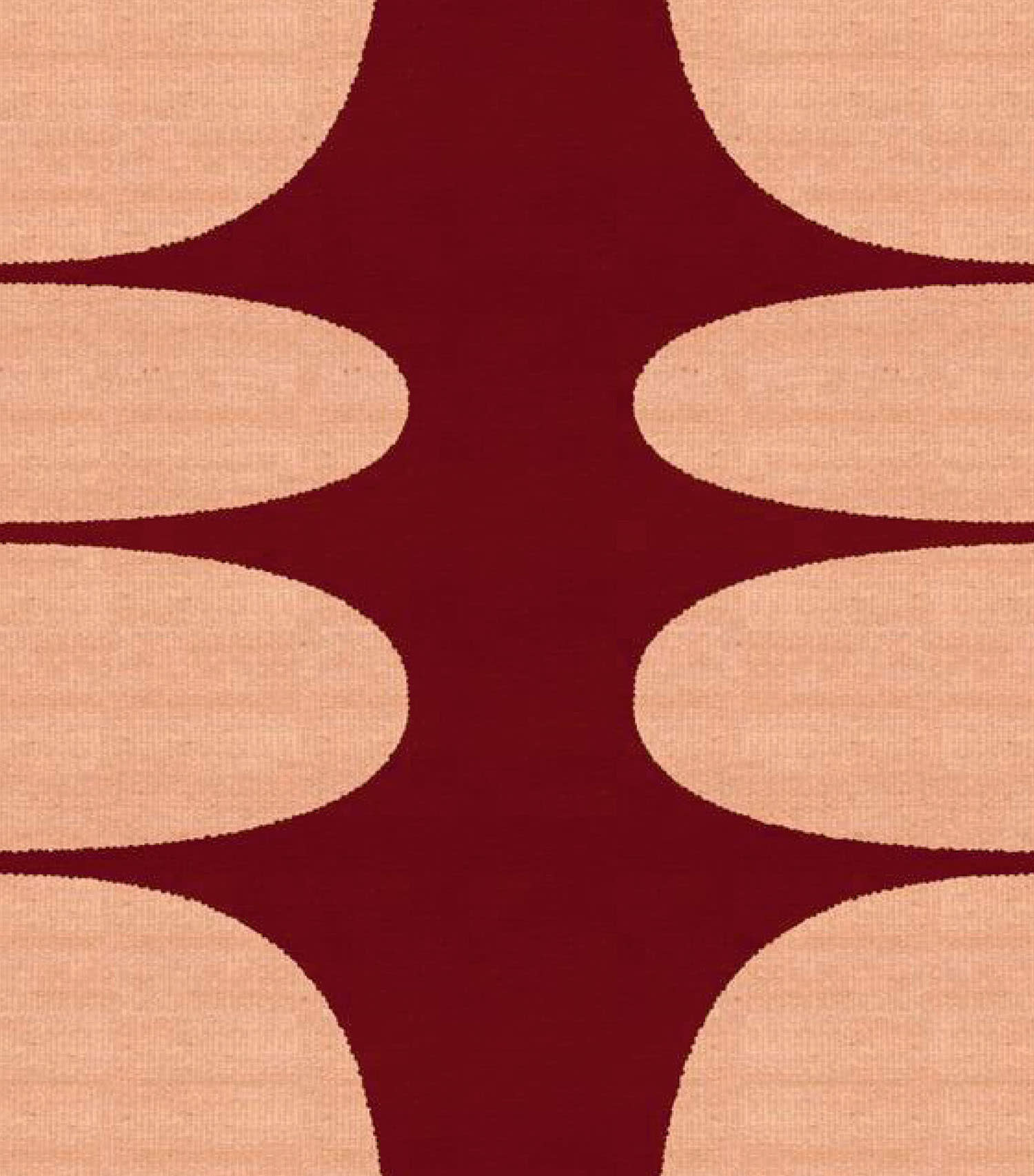 A rug with orange circular shapes on a dark red background.