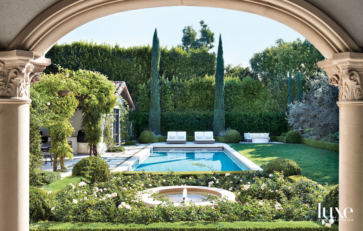 View towards pool and garden framed by columns