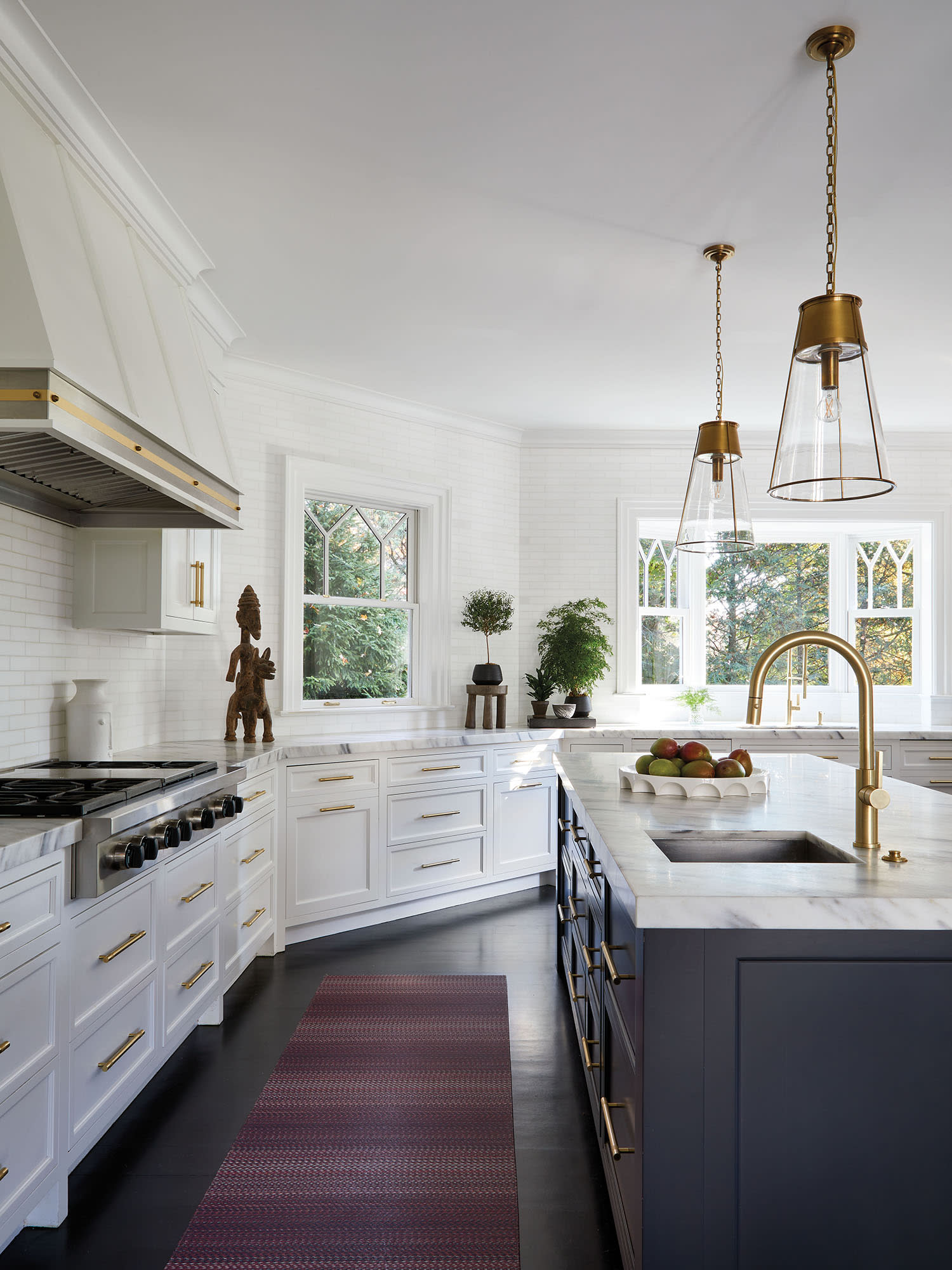 modern kitchen with white cabinetry and a dark gray island
