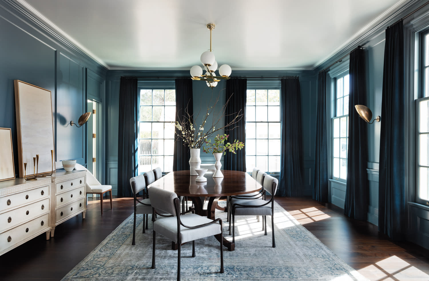 contemporary blue gray dining room with chandelier