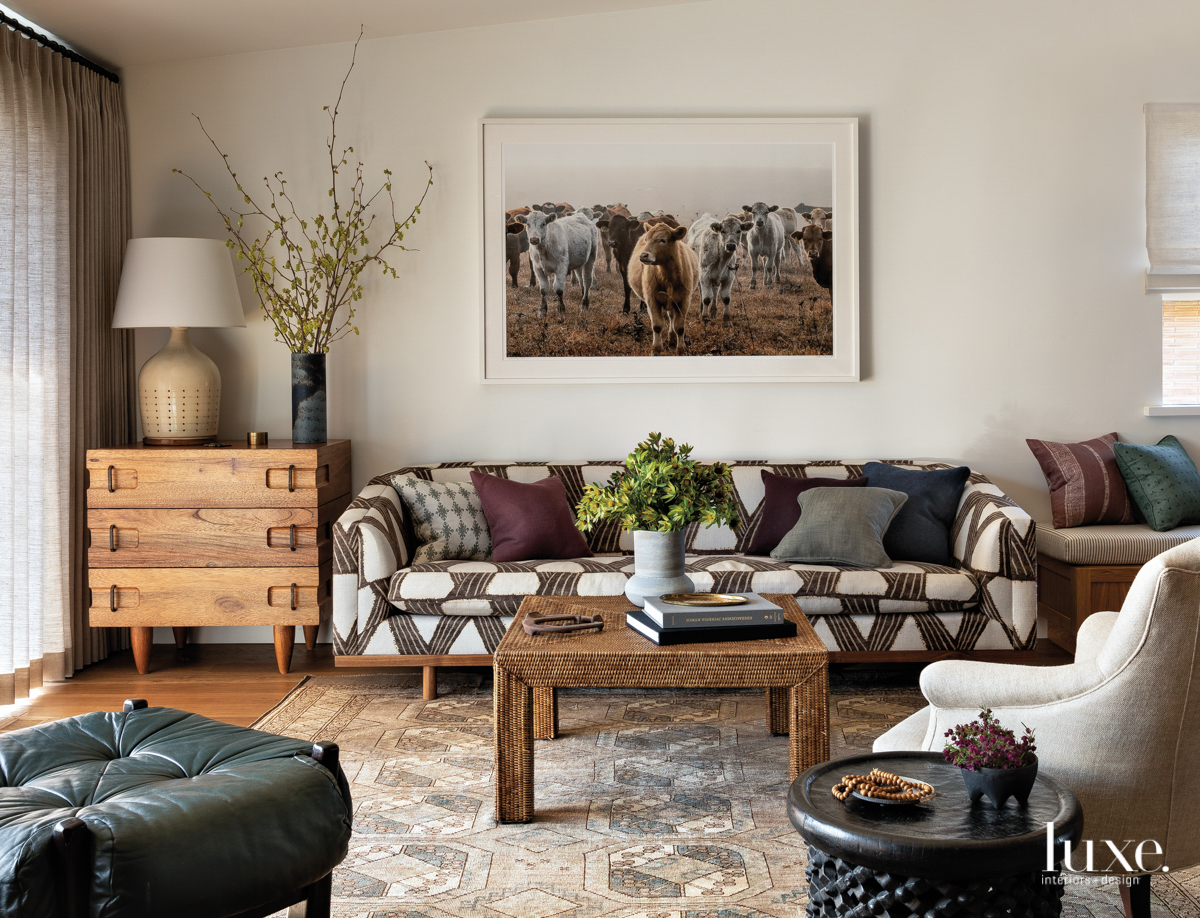 midcentury modern living room with cow art piece