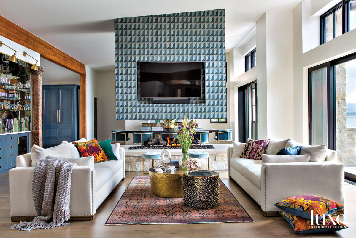 living room centered on a suspended fireplace